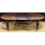 An early Victorian mahogany extending dining table, discorectangular top with moulded edge, one