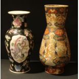 Oriental Ceramics - a Chinese famille noire porcelain baluster vase, painted with famille rose
