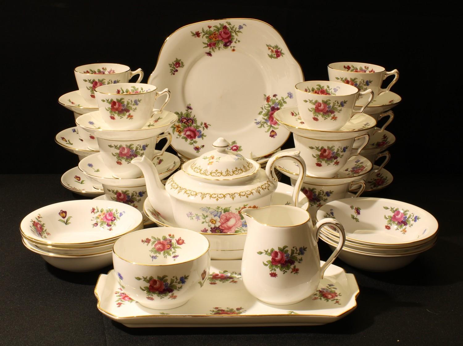 A Crown Staffordshire tea set, printed with colourful summer flowers, comprising, teapot, milk and