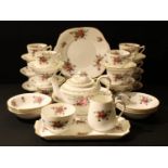 A Crown Staffordshire tea set, printed with colourful summer flowers, comprising, teapot, milk and