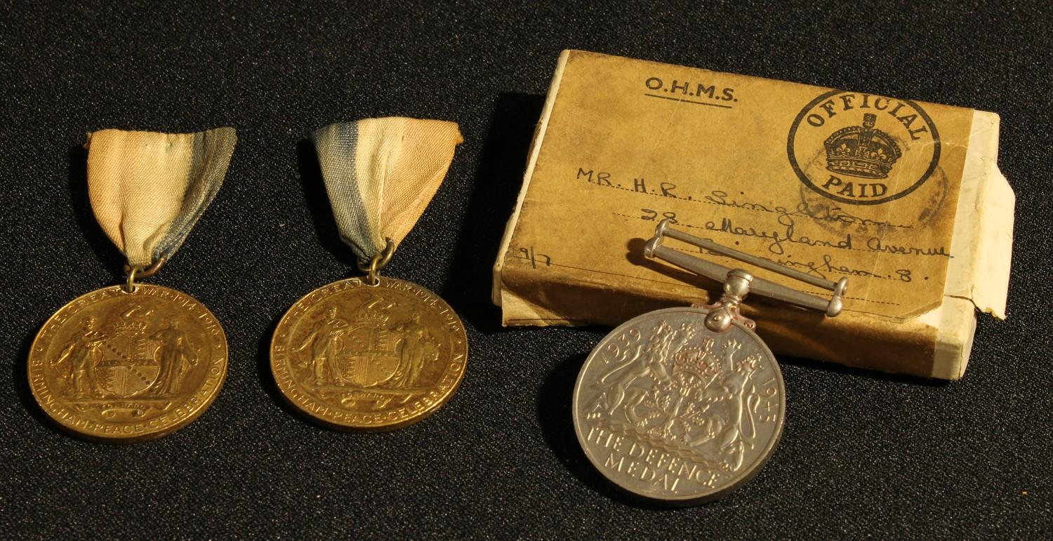 A Defence medal, boxed, HR Singleton; two Birmingham Peace Celebration Great War 1914-1918