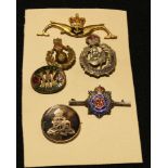 A 9ct gold and tortoiseshell Royal Artillery sweetheart brooch; a silver RASC badge; four others (6)