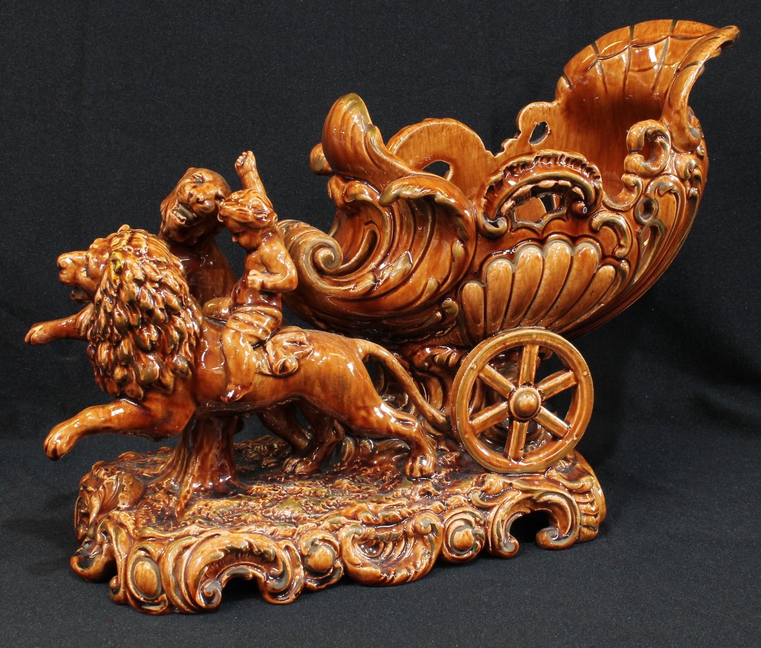 A late 19th/early 20th century Continental brown glazed Majolica type planter, modelled as a lion