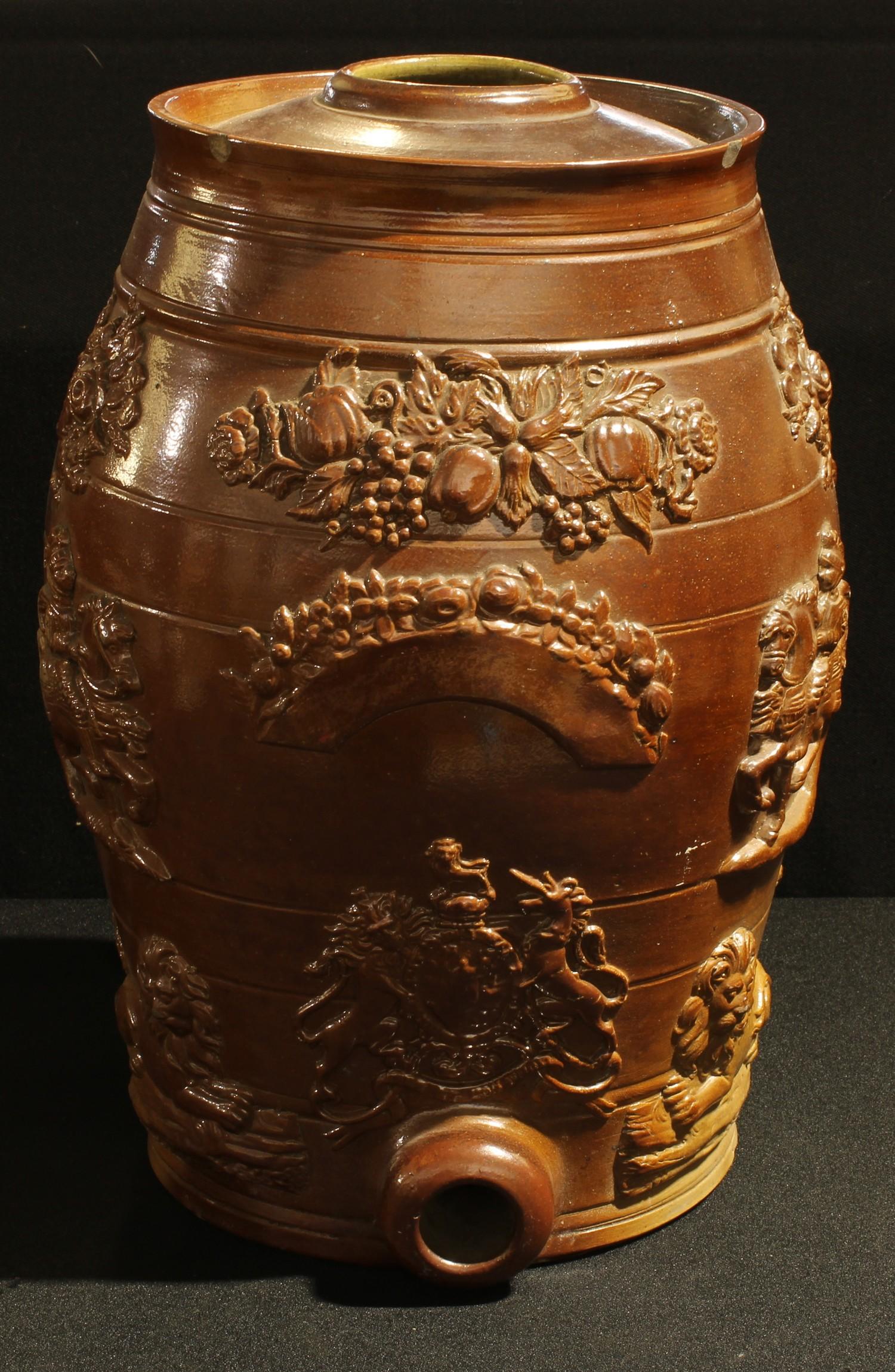 A 19th century brown salt glazed stoneware spirit barrel, applied in relief with Royal Crest,