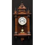 A late 19th century German 'Vienna' wall clock, by Junghans, architectural pediment, Roman numerals,
