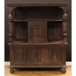 A late Victorian oak duodarn or side cabinet, in the 17th century taste, outswept cornice above a