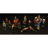 Toys - a collection of Britains painted lead Indian figures, various poses, some mounted on