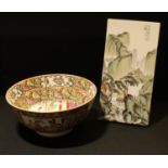 A Chinese famille rose bowl, character marks to base, 25.5cm diameter; a Chinese porcelain panel