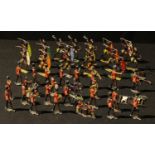 Toys - a collection of painted lead semi flat Zulu tribal warrior figures, various poses,