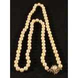 A single strand cultured pearl necklace, 18ct white gold clasp set with single pearl and four