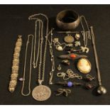 A sterling silver hinged bangle; a Siam silver necklace and pendant; an Israeli silver pendant and