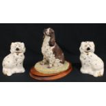 A Border Fine Arts resin model of a spaniel, by Margaret Turner, signed, dated 1993, oval wooden