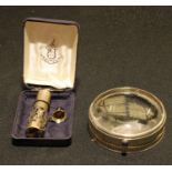 A silver perfume atomiser and scent funnel, London 1988, cased; a Cartier desk magnifyer (faults) (