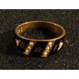 A Victorian mourning ring, black enamel and seed pearls, initialled IMO, 2.8g gross