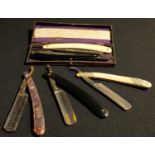A collection of five straight/cut throat razors including white metal overlay, Gong, Spikuson, etc