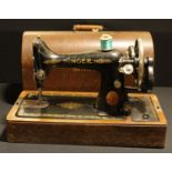 A Singer hand-crank sewing machine, cased