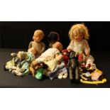 Dolls - various painted composition and plastic dolls including a black Roddy doll