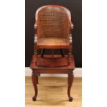 A Victorian mahogany child's combination high chair and table, curved back terminating in scroll