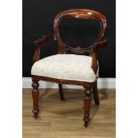 A Victorian style mahogany balloon back desk or elbow chair, 91.5cm high, 61.5cm wide, the seat 45cm