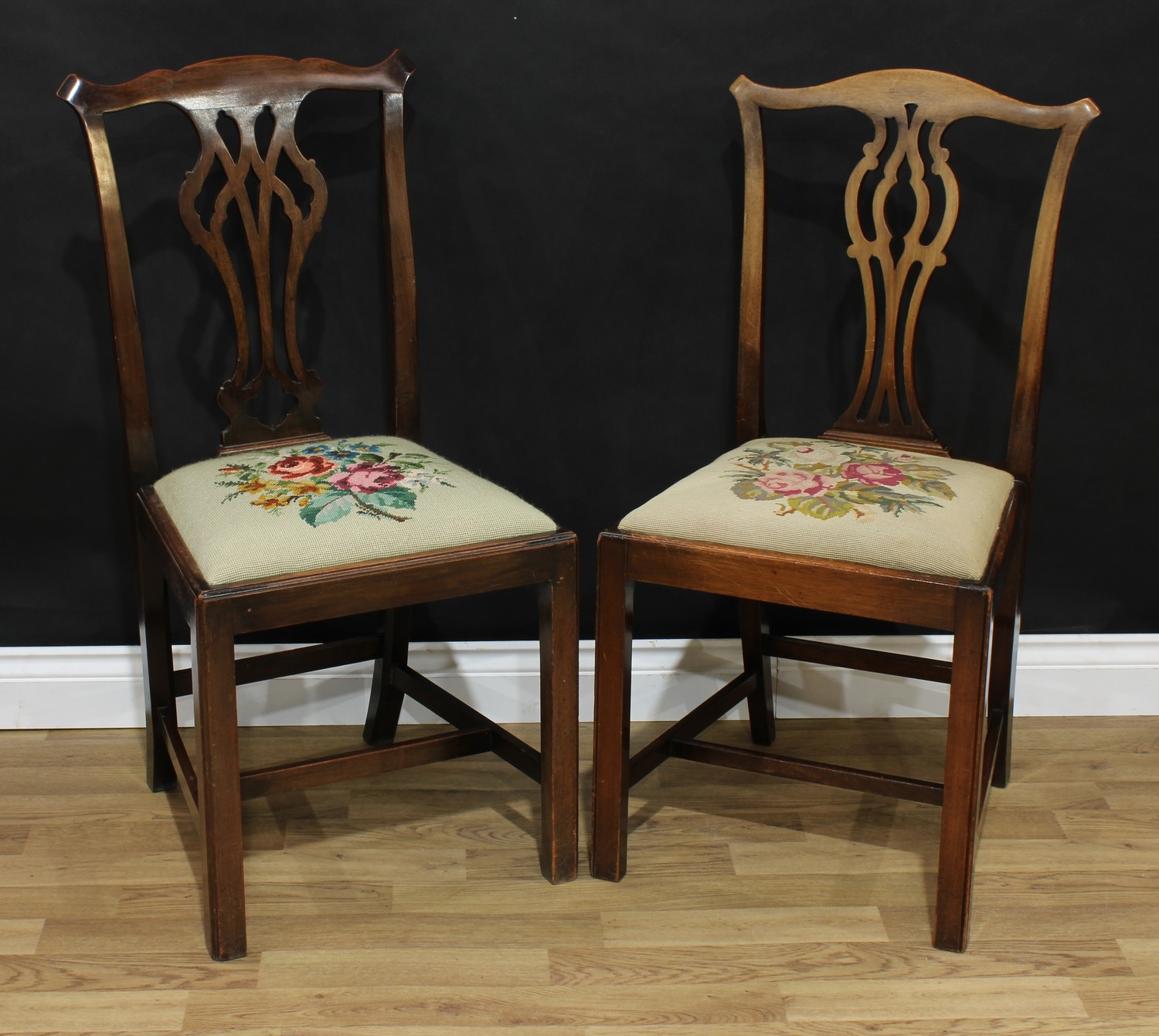 An associated pair of George III style Chippendale design dining side chairs, one stamped 4156