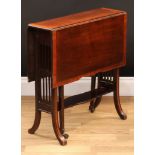 An Edwardian crossbanded mahogany Sutherland table, shaped rectangular top with fall leaves,