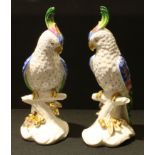 A pair of Portuguese Vista Alegre hand painted cockatoo models, in bright colours, 26.5cm