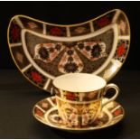A Royal Crown Derby Imari palette 1128 pattern teacup and saucer, first quality; an 1128 pattern