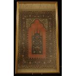 An Islamic prayer rug, approx. 70cm x 38cm