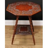 An early 20th century mahogany occasional table, octagonal top carved with flowers and foliage,