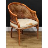 A Regency design beech faux-bamboo bergere library chair, 83cm high, 59cm wide, the seat 50cm deep