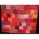 Textiles - a quilted patchwork bed cover, in bright colourful fabric samples, double size,