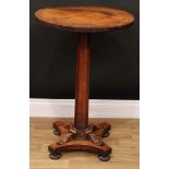 A George/William IV rosewood statuary table, circular top, spreading octagonal panelled column,