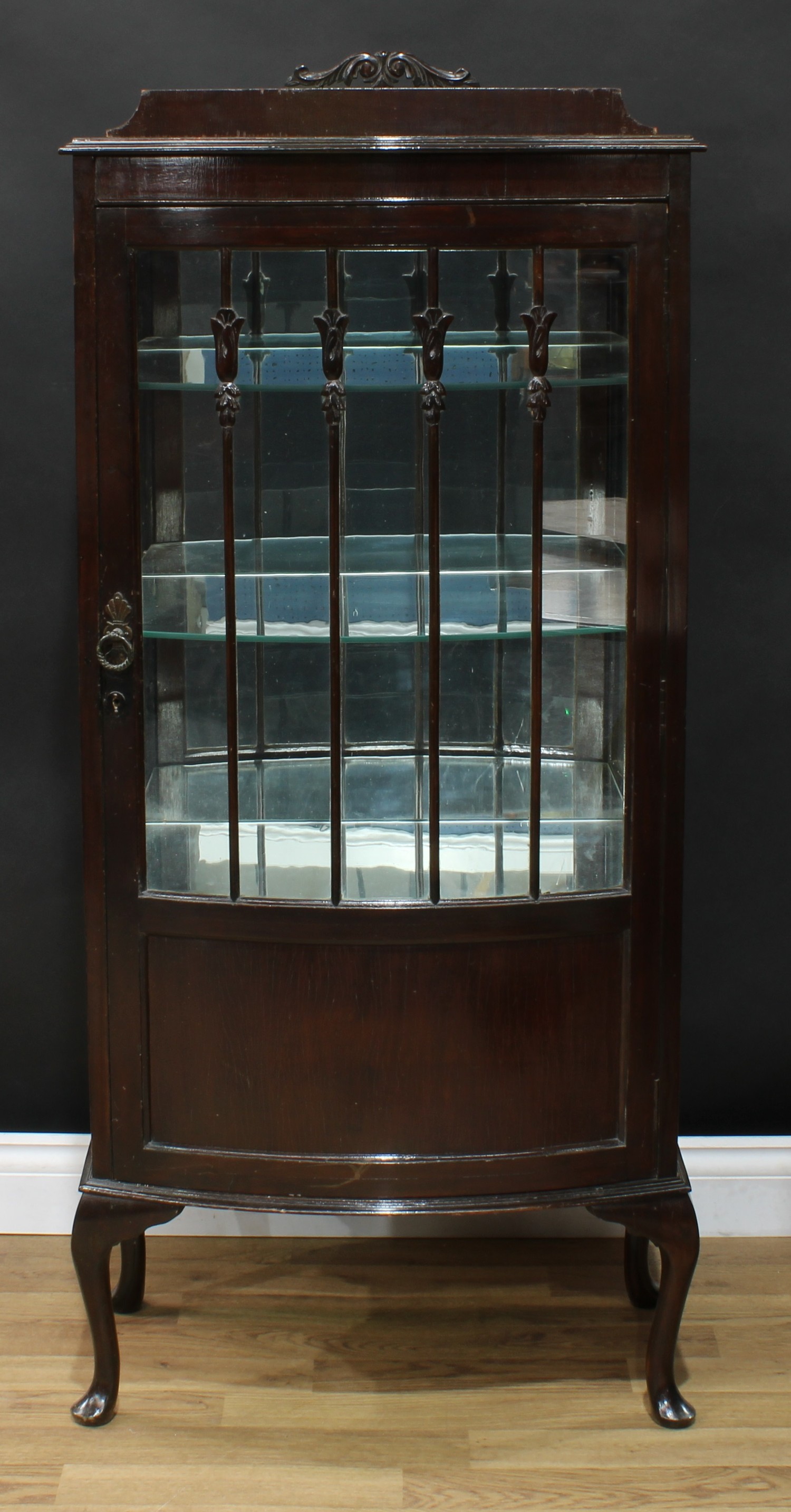 An early 20th century mahogany bow fronted display cabinet, 136.5cm high, 60.5cm wide, 39cm deep,