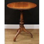 A George III style oak and mahogany tripod occasional table, circular top with fall leaves, turned