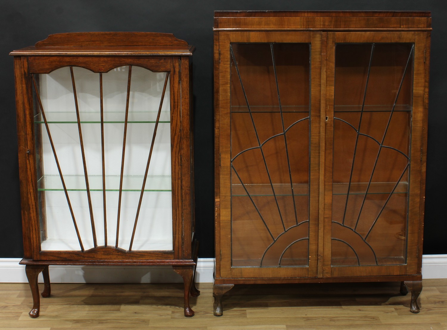 An early 20th century walnut and mahogany display cabinet, 132cm high, 90cm wide, 25cm deep;