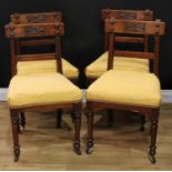 A set of four Victorian Reformed Gothic dining chairs, 86cm high, 48cm wide, the seat 37cm deep, c.