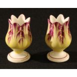A pair of 19th century English porcelain vases, of small proportions, each modelled and