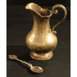 A late 19th century silver cream jug, scroll handle reeded edge, London, marks rubbed, 5oz; a