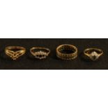 A 9ct gold eternity ring, set with diamond chips; three other 9ct gold dress rings, 9.8g