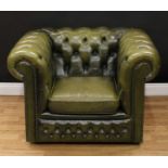 A Chesterfield design reception office armchair, stuffed-over deep-button upholstery, squab cushion,