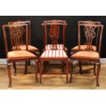 A set of four Chippendale design dining side chairs, 97.5cm high, 53cm wide, the seat 44cm wide