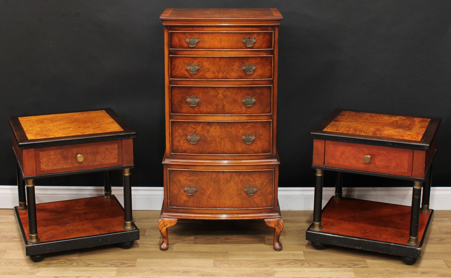 A George II style mahogany crossbanded walnut bow front chest, oversailing top above five