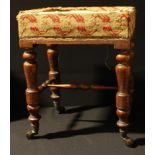 An oak footstool, woolwork tapestry upholstery, turned legs, ceramic casters, 45cm high, c.1900