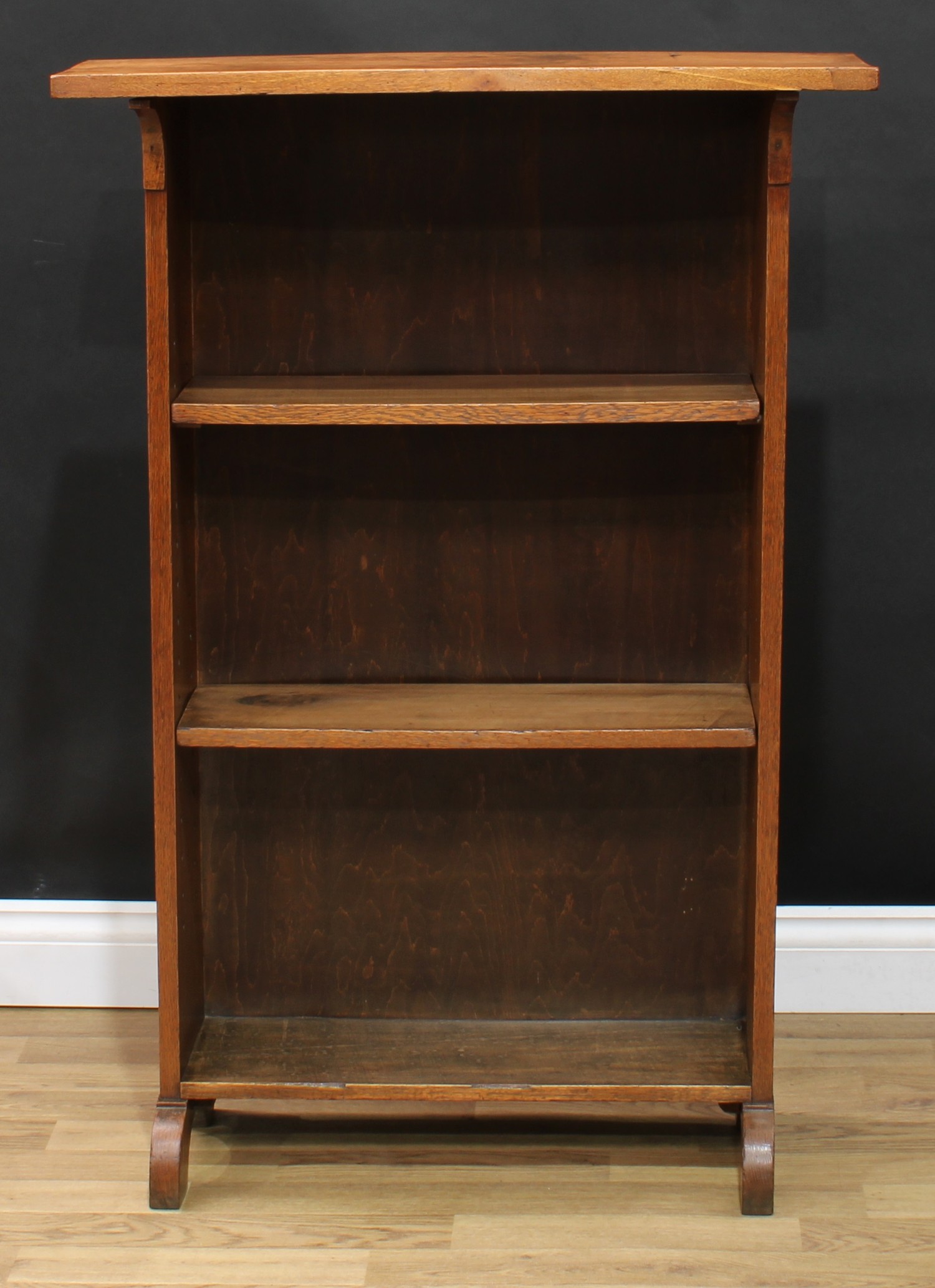 An Arts and Crafts oak open bookcase, 110cm high, 76cm wide, 32cm deep