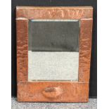 An Arts and Crafts rectangular copper wall mirror, planished throughout, bevelled glass, 44cm x 32cm