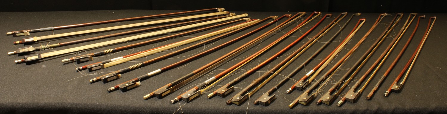 A collection of violin bows