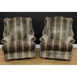 A pair of George III style wingback reception armchairs, 106cm high, 92cm wide, the seat 55cm wide