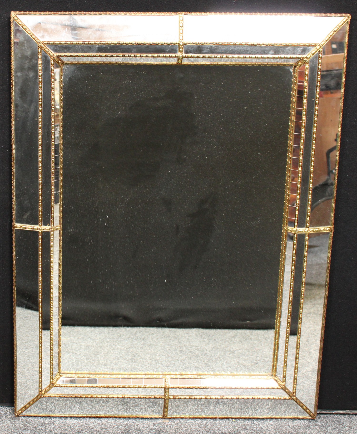 A Venetian style rectangular wall mirror, 87cm x 67cm