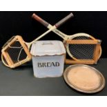 An early 20th century enamelled bread bin; an E.P.N.S. mounted bread board; a Slazenger tennis
