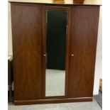 A Stag minstrel triple wardrobe, central bevel edge mirrored door, 204cm high, 174cm wide, 60cm deep